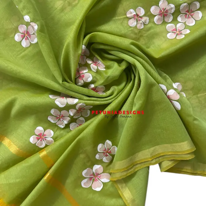 Floral hand-painting on unisex dress material. Unisex hand-painted dress material with vibrant floral and leaf designs.